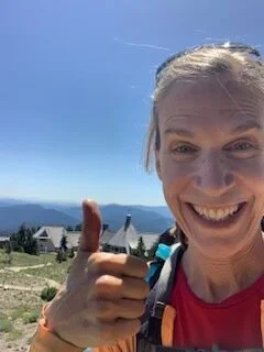 Client Suzie smiling outdoors